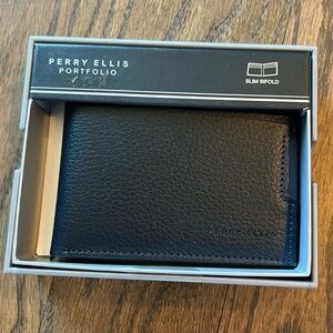 NWT Perry Ellis navy slim bifold leather wallet in box.
